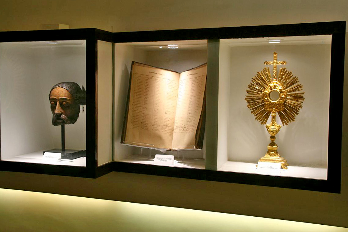 Head of Christ in wood (1600 - 1630); Marriage record (1886); Gilded Monstrance (1750 – 1800).